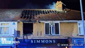 Eight crews stop fire above bakery from spreading