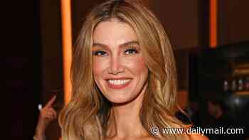 Delta Goodrem looks pretty in pink at the Attitude Pride Awards in London after Eurovision heartbreak - as she teases exciting new chapter