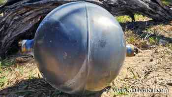 Warning is issued after 'potentially hazardous' unidentified objects wash up on Aussie beach