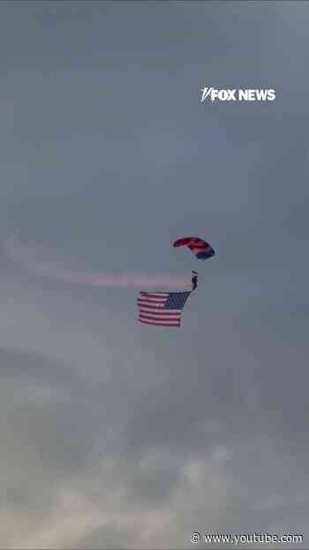 WATCH: Patriot parachute team soars GIANT American flags into Cody Stampede Rodeo