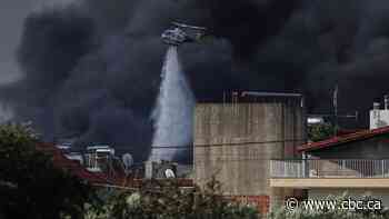 Hundreds of firefighters battle wildfire in Portugal, Greek authorities warn of toxic smoke