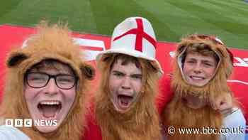 Fans dress as three lions in support of Three Lions