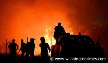 Hundreds of firefighters battle a wildfire in Portugal, while Greek authorities warn of toxic smoke