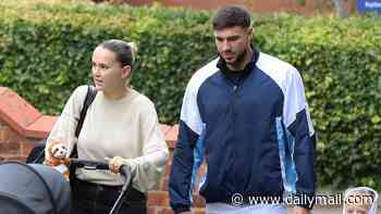 Molly-Mae Hague and Tommy Fury put on a weary display as they step out with Bambi, three, and newborn Midas - after saying she's 'winging it every day' and joking about 'mile long roots'
