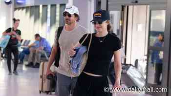 Gigi Hadid smiles as she jets out of NYC with Bradley Cooper the day after Taylor Swift and Travis Kelce's wedding
