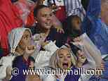 Kate Kane and Megan Pickford celebrate in the stands as their Three Lions husbands beat Mexico