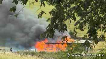 Murder probe launched after body of woman, 30s, found after farm fire as man arrested