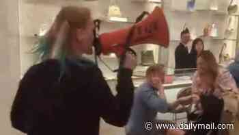 Moment anti-fur activists storm London Dior store in front of shocked families before being thrown out by heroic security guards