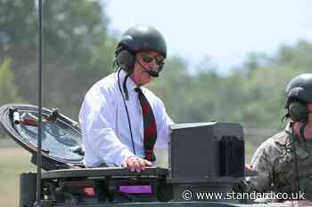 Heavy metal: King rides British Army tank in visit to regiment