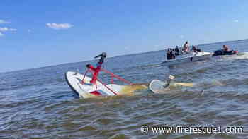 Surfacing whale sinks N.J. fireboat