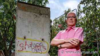 Homeowner who erected section of Berlin Wall in his garden without planning permission is ordered to tear it down or pay £20,000 fine after council warned it created an 'oppressive sense of enclosure'