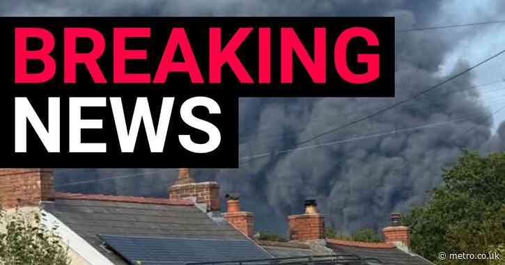 Huge inferno sweeps over oil refinery site as villagers urged to stay back