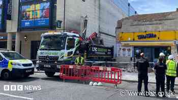 Lorry demolishes wall between two buildings