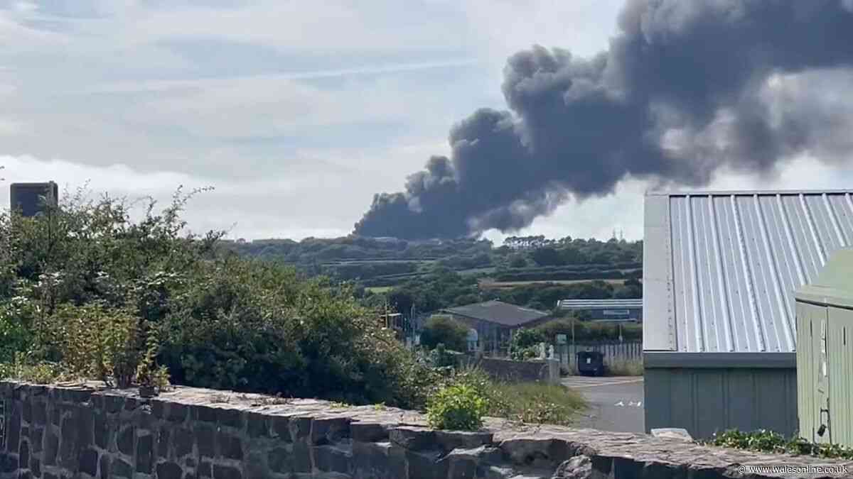 Black smoke fills the air as fire breaks out at former oil refinery