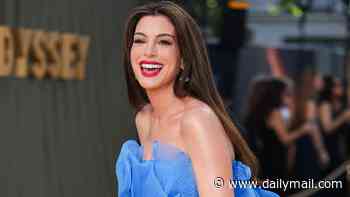 Pregnant Anne Hathaway, 43, shows off her blossoming baby bump in a strapless blue chiffon gown at The Odyssey premiere after sharing surprise baby news