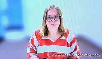 An Idaho mother who said her toddler twins died after vaccinations has been charged with murder