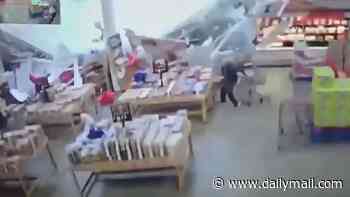 Terrifying moment roof COLLAPSES on shoppers at busy store sparking panic and sending shelves flying