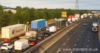 M25 traffic LIVE: Drivers face 13 mile queues and 110 minute delays after three lanes shut by vehicle fire