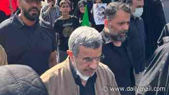 Iran's ex president Ahmadinejad 'comes back from the dead' as he is seen at Supreme Leader's funeral - weeks after state-media announced his death in US war