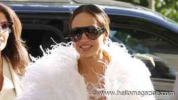 Jennifer Lopez exposes micro bra in daring feather look