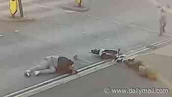 Moment e-scooter rider leaves woman crossing the road seriously injured after ploughing into her before callously riding away - as figures show payouts from crashes reach £110million