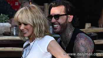 Olivia Attwood passionately kisses Pete Wicks before he carries her designer bag for dinner date in Ibiza