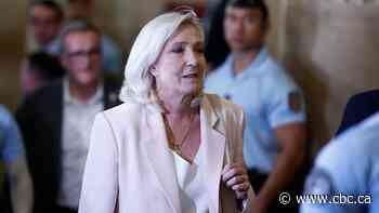 French court opens door for Marine Le Pen to run for president, with ankle monitor