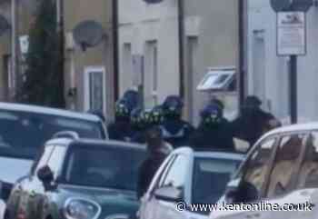 Watch moment police pile into home in dawn raid