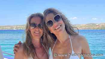 Elizabeth Hurley slips into tiny white bikini to twin with lookalike sister Kate