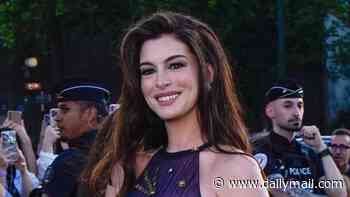 Pregnant Anne Hathaway wows in night-sky inspired dress at The Odyssey premiere in Paris after sharing surprise baby news