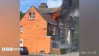 Road closed after fire breaks out in flat