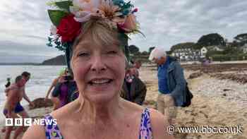 Crowds turn out to mark woman's 1,000th daily dip