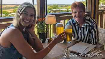 Holly Valance enjoys a drink with Pauline Hanson at Jeremy Clarkson's pub in England after endorsing One Nation leader: 'Nothing like a beer with your mate at the pub on a hot day'