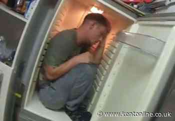 ‘Get out before I pull you out’: Bizarre moment police find violent bully hiding in fridge