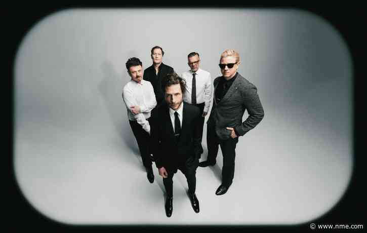 Interpol stare down AI on atmospheric new single ‘Iron City’