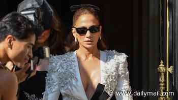 Jennifer Lopez turns heads in a plunging sequin blazer dress as she continues her Parisian fashion parade at Zuhair Murad fashion show in Paris