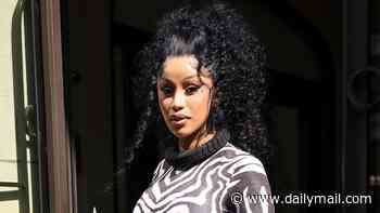 Cardi B catches the eye in a zebra print catsuit during Paris Fashion Week - after revealing she underwent butt reduction surgery