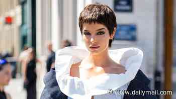 Maura Higgins embraces the pixie cut as she commands attention in bizarre shirt-cape ensemble at the Viktor & Rolf Haute Couture Fashion Week show in Paris