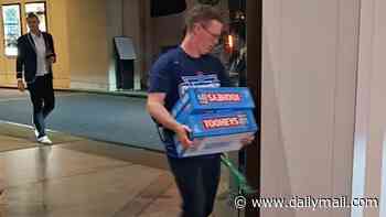 Blues players and their coach bring slab after slab of grog back to team hotel to kick off wild Origin celebrations
