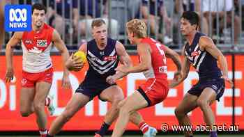 Live: Dockers and Swans battle for top spot as Lions recall big guns