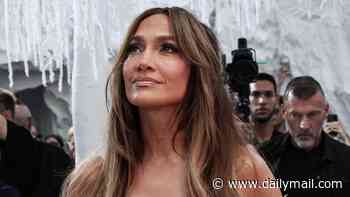 Jennifer Lopez makes a jaw-dropping appearance in a plunging sheer beaded gown as she dazzles at the Celia Kritharioti Paris Haute Couture Fashion Week show