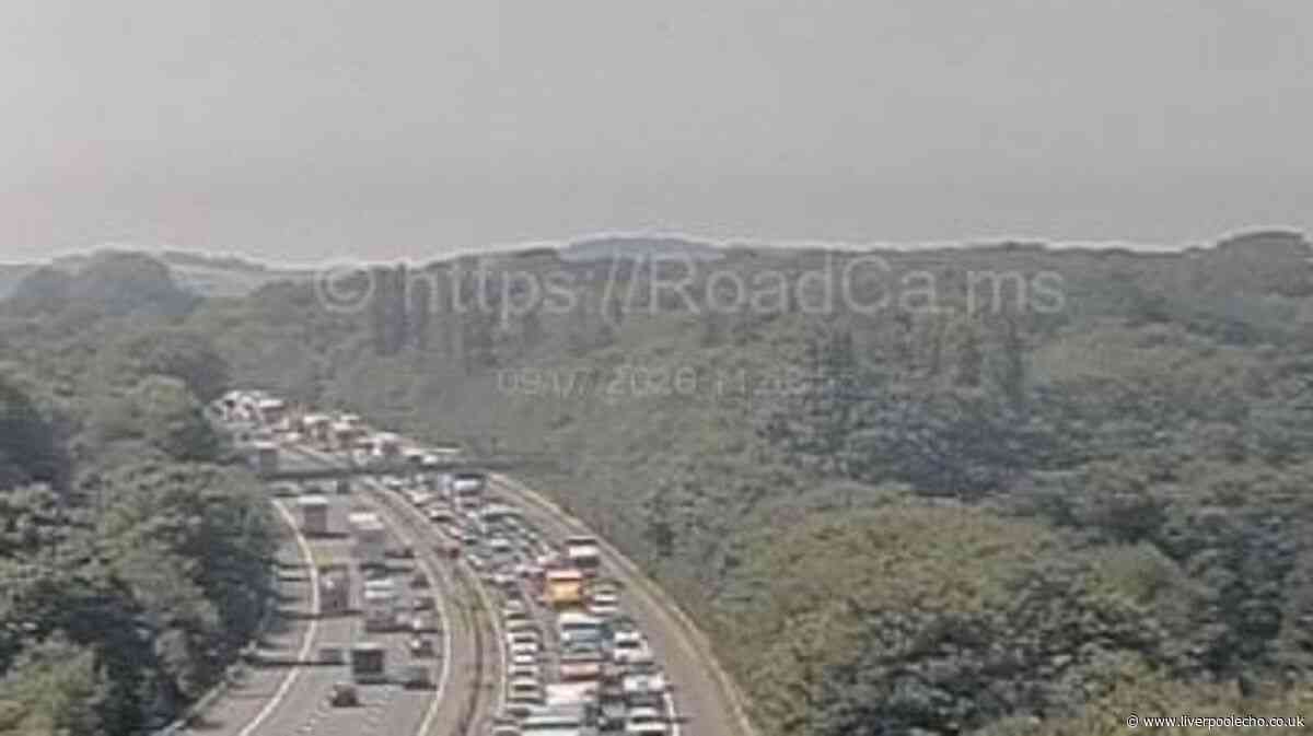 M56 traffic delays live as vehicle overturns