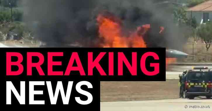 Fighter jet goes up in flames after crash landing at airport