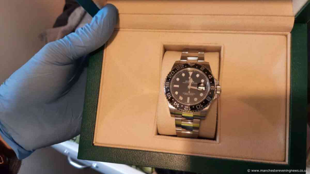 Police descend on Wigan homes in dawn raids and seize Rolex and knives