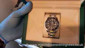 Police descend on Wigan homes in dawn raids and seize Rolex and knives