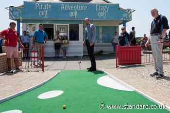 Prince of Wales plays crazy golf after ride on funicular