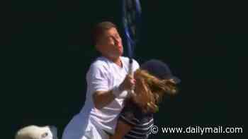 Wimbledon star CLATTERS ball girl, sending them both crashing into the concrete at the back of the court