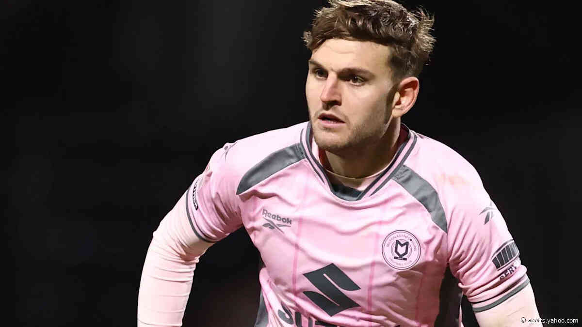 Rochdale sign former MK Dons defender Maguire