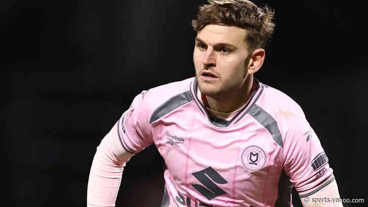 Rochdale sign former MK Dons defender Maguire