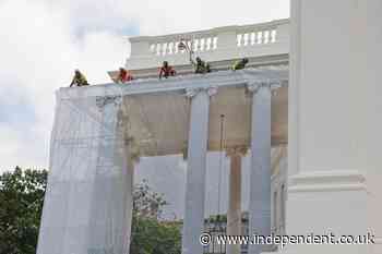 Shrouded in no mystery at all: Trump drapes North Portico in tarp that offers a peek at the latest White House facelift